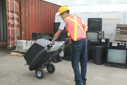 Employees sorting recyclable materials in a workplace